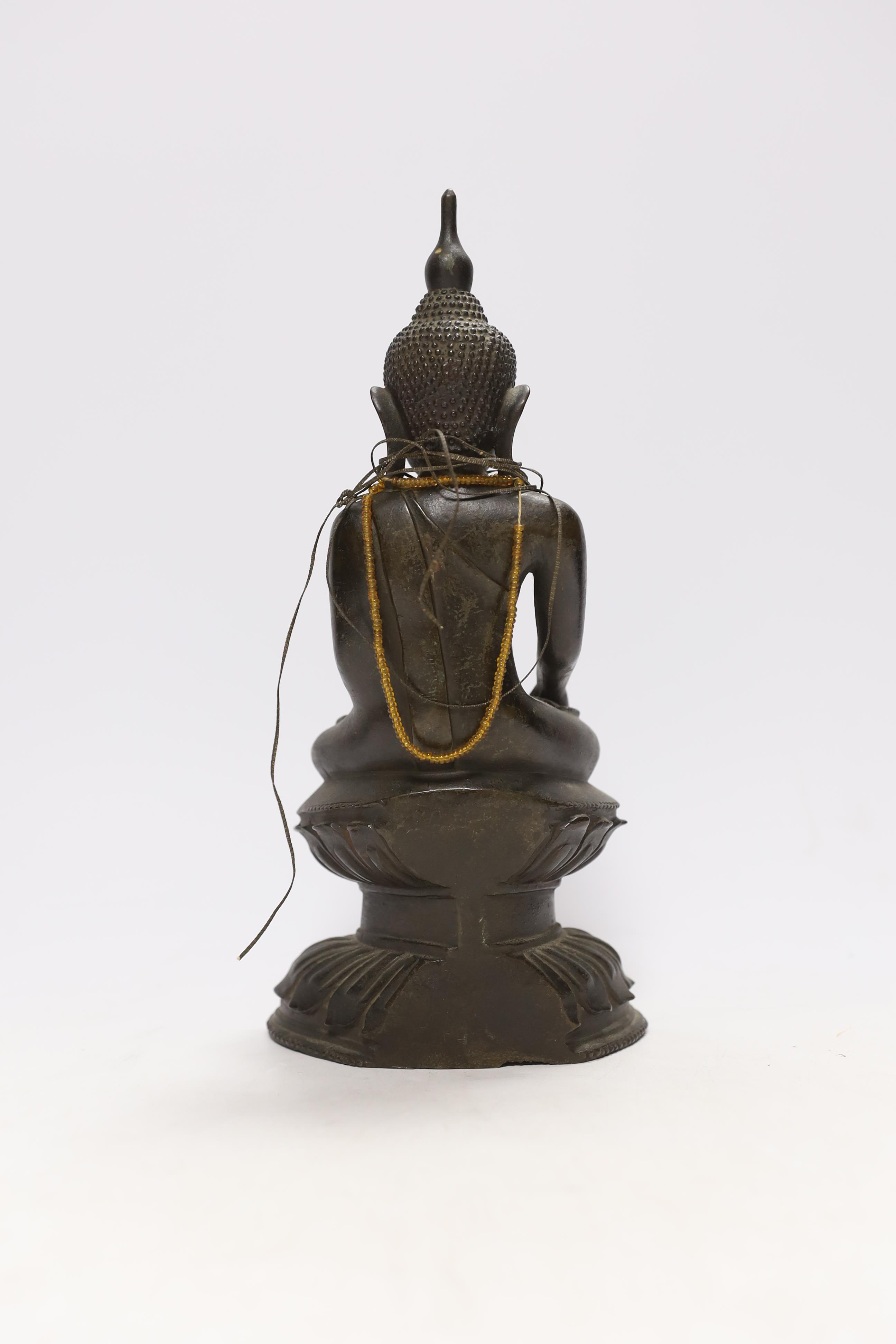 A 19th century Burmese bronze figure of Buddha, 26cm high